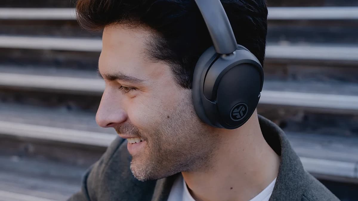 JLab - man wearing over the ear headphones